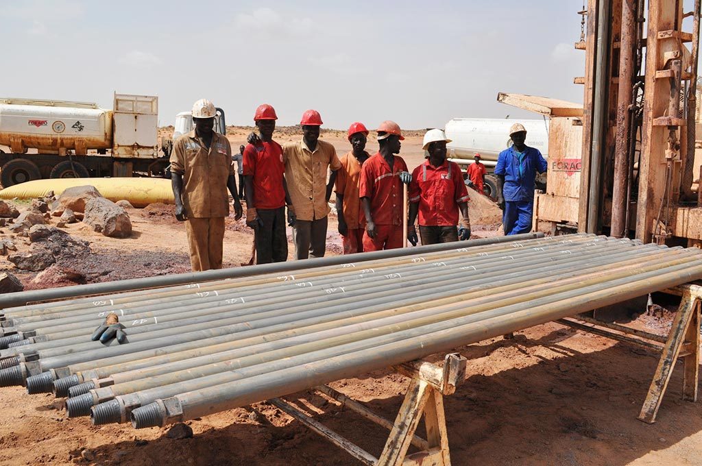 Workers pose with drill rods at Global Atomic's DASA project in Niger. Credit: Global Atomic.
