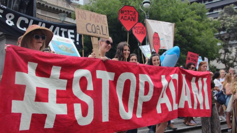 Crowd protests the Carmichael coal project in Australia.